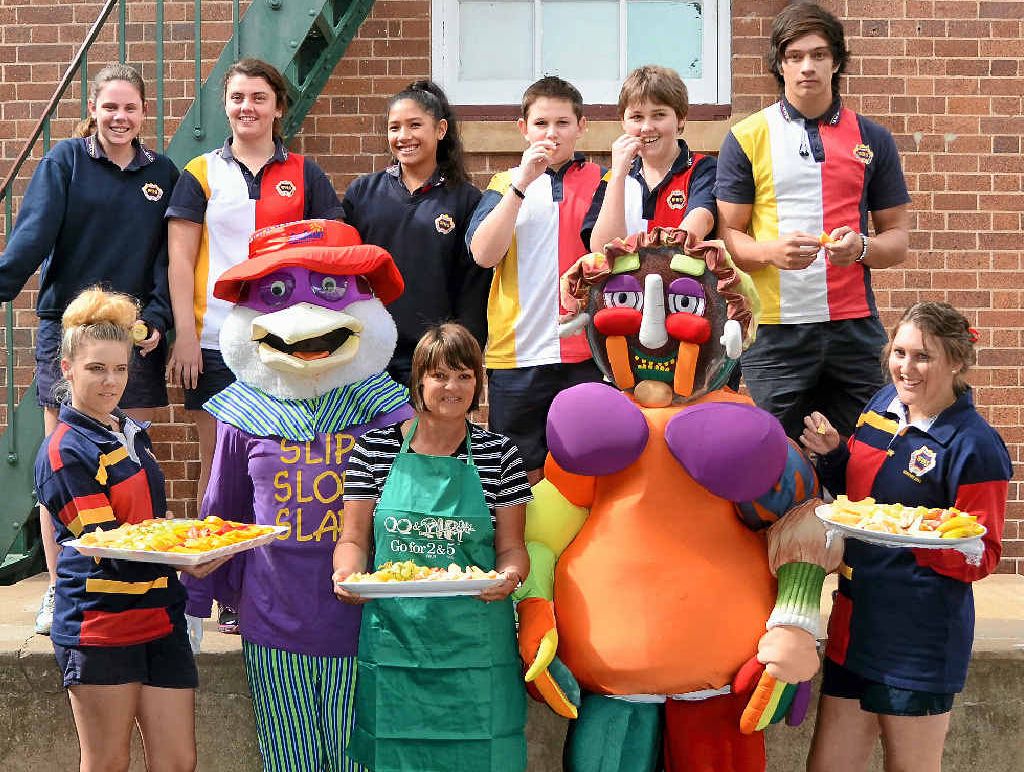 Nurse Denis Dixon and two colourful friends give Warwick High School Students get a healthy dose of fresh fruit to celebrate Health Week. Nurse Denis Dixon and two colourful friends give Warwick High School Students get a healthy dose of fresh fruit to celebrate Health Week.